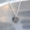 Silverhalsband med hjärta i stål.
